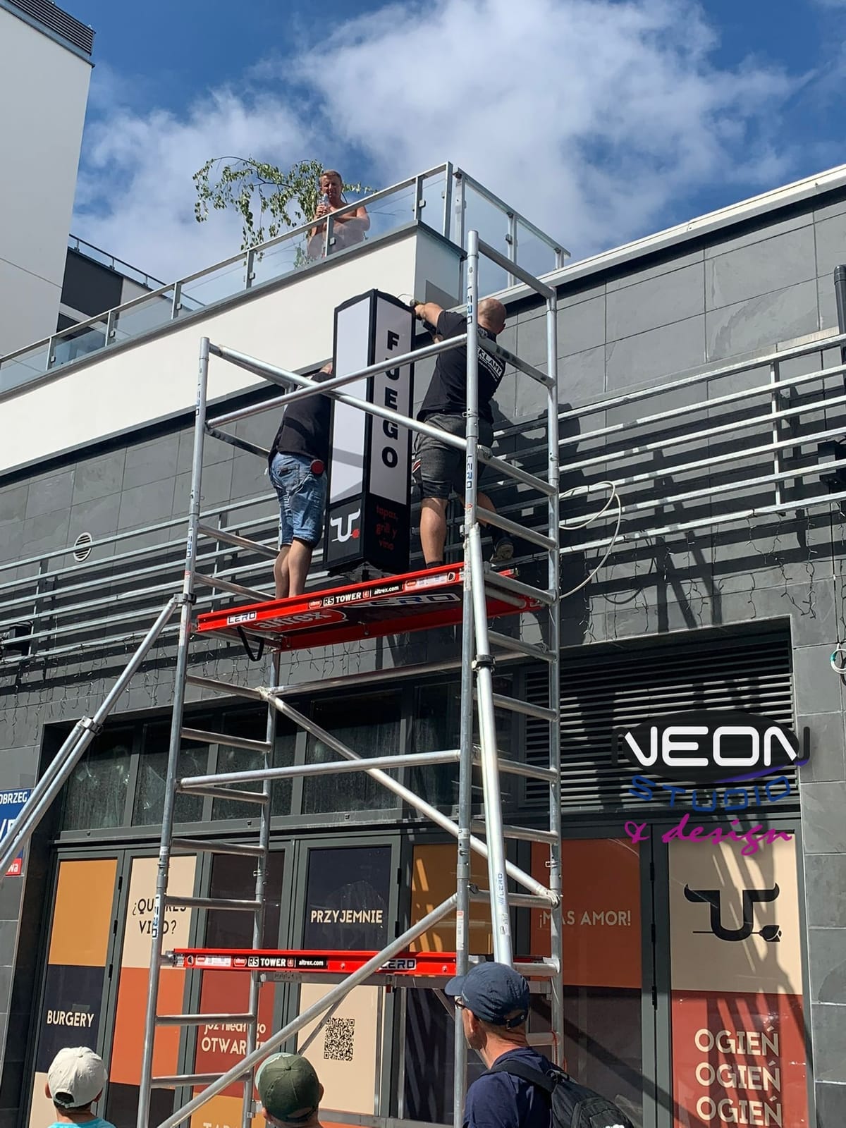 Projecting Sign Installation from Scaffolding